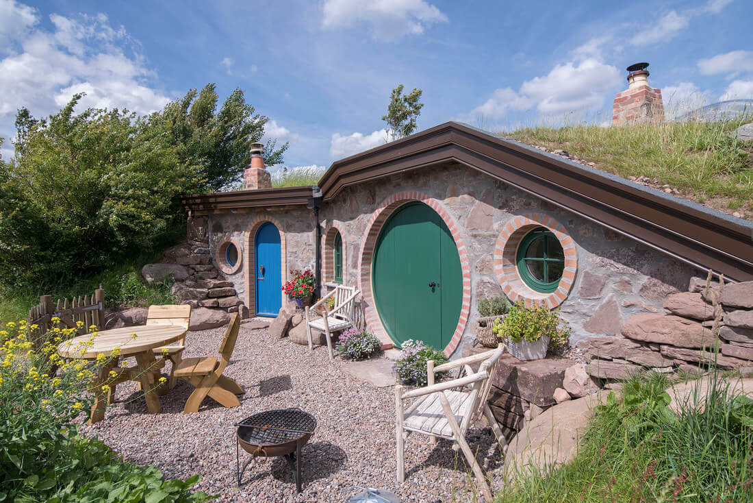 Unique hobbit hole glamping cottage with green door