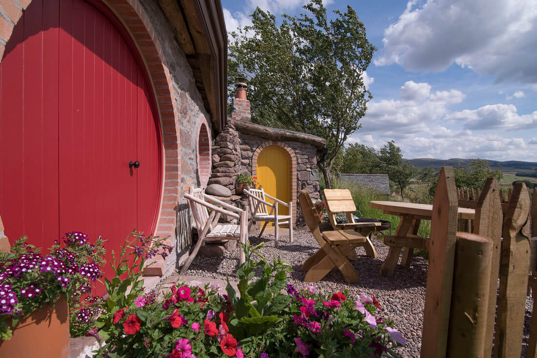 Glamping Hobbit hole with red door