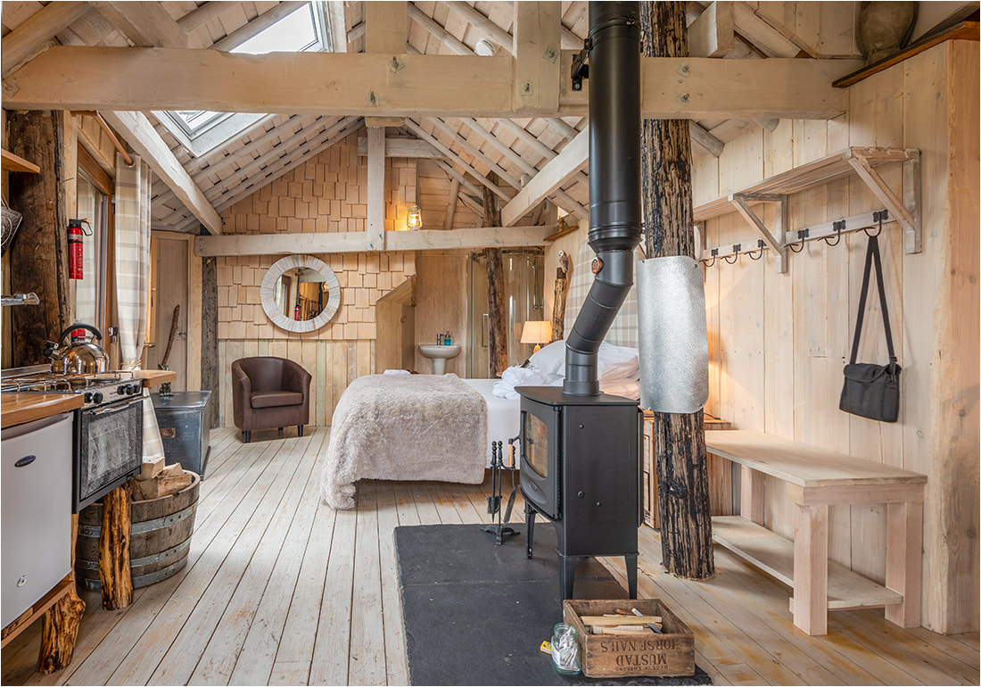 Interior of romantic getaway treehouse glamping site