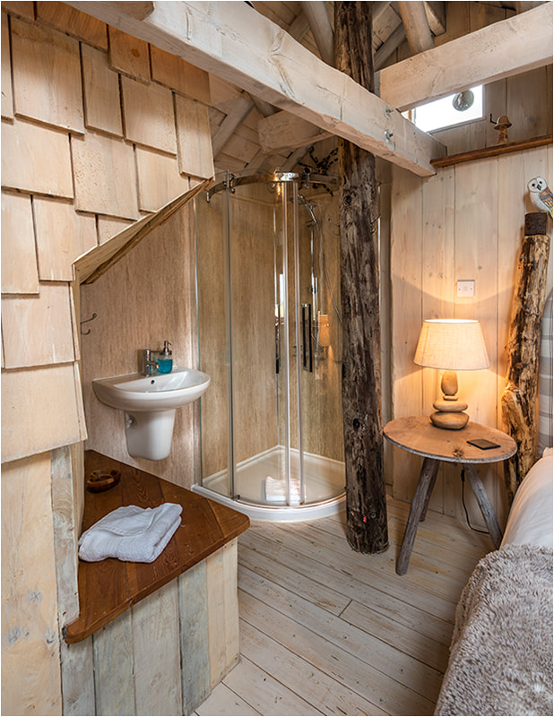 Interior of romantic getaway treehouse glamping site
